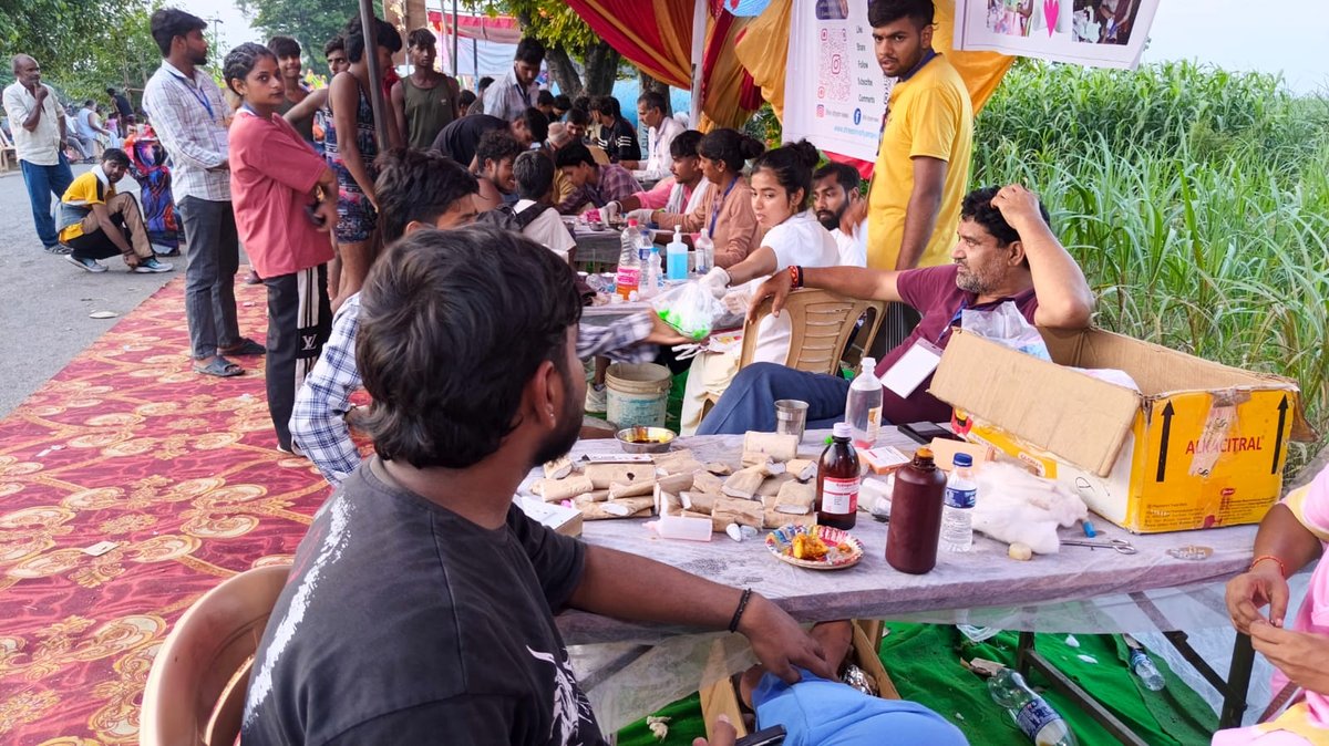 Volunteers attending to pilgrims at the camp tent